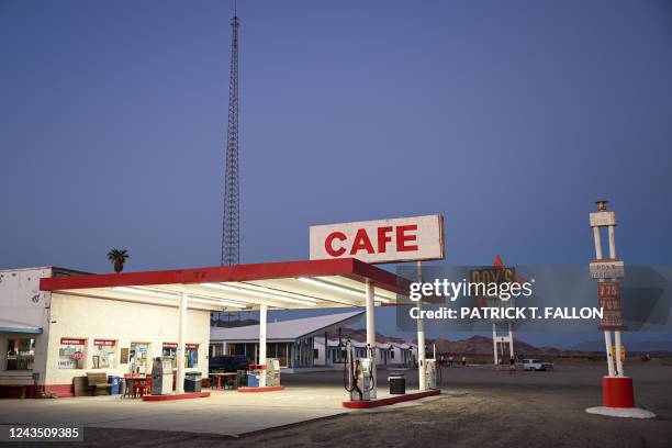 This photograph taken on August 30, 2022 in the Mojave Desert city of Amboy, California, USA, shows the petrol station next to Roy's Motel Cafe,...