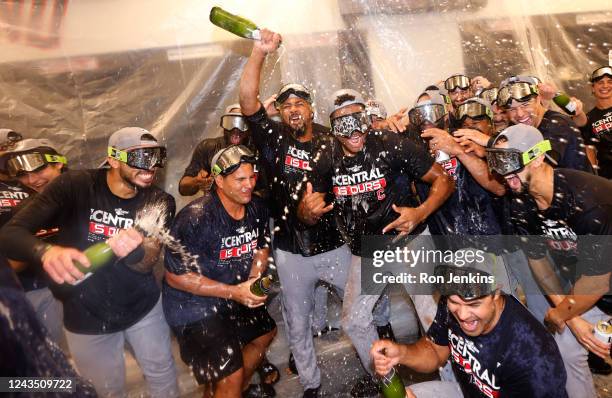 The Cleveland Guardians celebrate after defeating the Texas Rangers 10-4 and clinching the American League Central Division at Globe Life Field on...