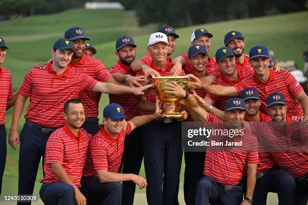 The United States Team celebrates after defeating the International Team to take home the Presidents Cup Trophy during the final round Sunday singles...