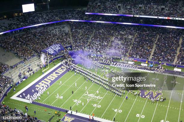 Washington players run out from Husky tunnel onto the field during a college football game between the Washington Huskies and the Stanford Cardinal...