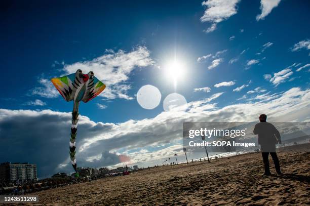 Man is seen flying his huge kite in the sky. The International Kite Festival Scheveningen makes the most of the consistent prevailing winds blowing...