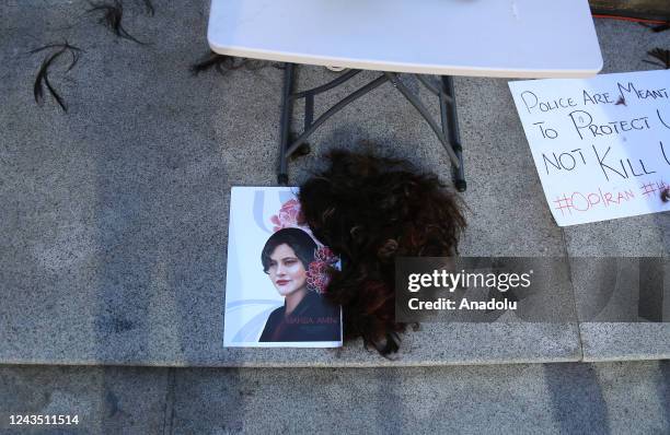 Pile of human hair lies on the ground after protesters cut their hair, outside Vancouver Art Gallery, during a solidarity protest for Mahsa Amini, a...