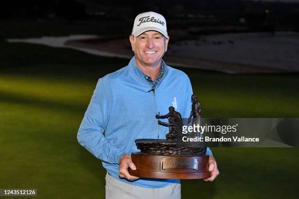 Steve Flesch holds the championship trophy after winning the PURE Insurance Championship at Pebble Beach Golf Links on September 25, 2022 in Pebble...