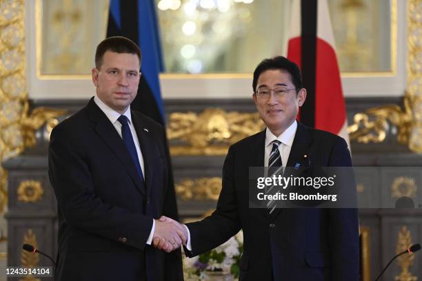 Fumio Kishida, Japan's prime minister, right, shakes hands with Juri Ratas, Estonia's former prime minister, at the Akasaka Palace in Tokyo, Japan,...