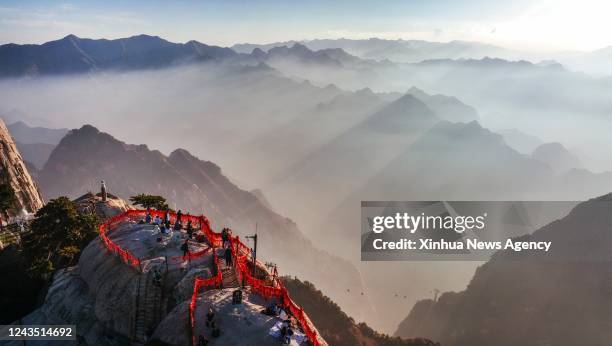 Aerial photo taken on Sept. 25, 2022 shows the view of Mount Huashan at sunset in northwest China's Shaanxi Province.