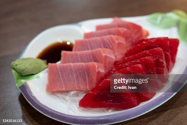 fresh raw tuna sashimi fish served on table - sashimi imagens e fotografias de stock