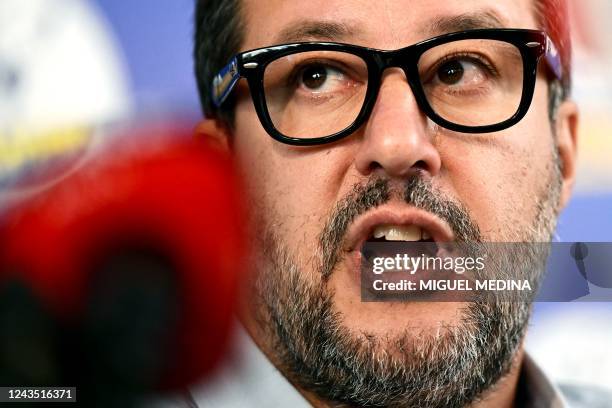 Leader of the Italian right-wing Lega party, Matteo Salvini delivers an address on September 26, 2022 at his party's campaign headquarters in Milan,...