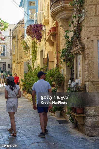 People walking by the old town street are seen in Rabat , Malta on 23 September 2022