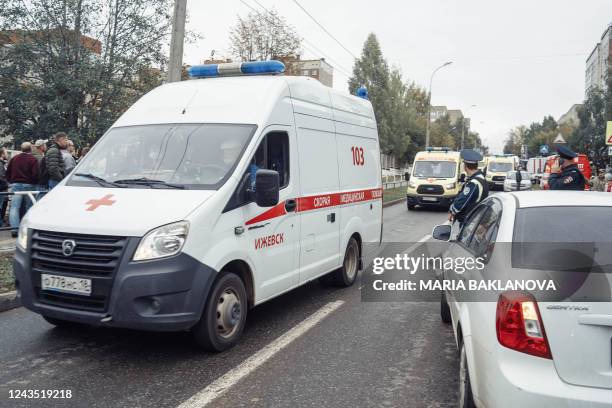 Ambulances move on a road near the scene of a shooting in school No88 in Izhevsk on September 26, 2022. - The death toll has risen to 13 people,...