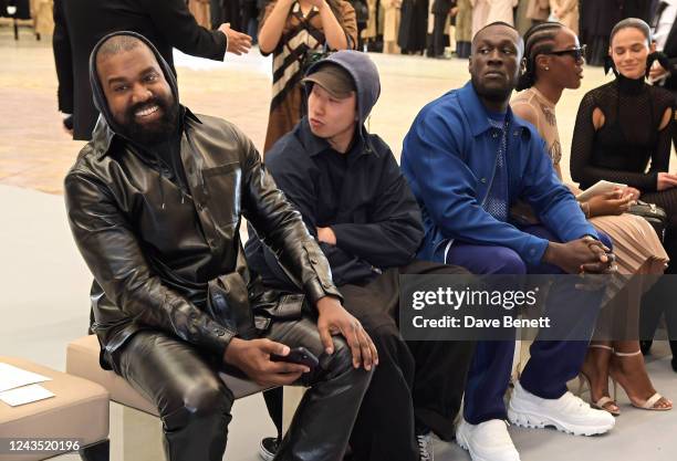 Kanye West, guest, Stormzy, Melissa Holdbrook-Akposoe aka Melissa's Wardrobe and Bruna Marquezine attend the Burberry Spring/Summer 2023 runway show...