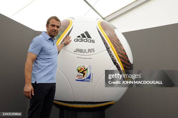 Germany's co-trainer Hansi Flick poses is front of a giant football during a press conference in Appiano, near the north Italian city of Bolzano May...