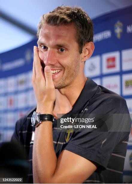 Swedish goalkeeper Andreas Isaksson talks to members of the media following a training session at the Swedish training camp in Lugano, Switzerland on...
