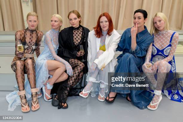 Guest, Stella Maxwell, Fran Summers, Karen Elson, Erin O'Connor and Ella Richards pose backstage at the Burberry Spring/Summer 2023 runway show in...