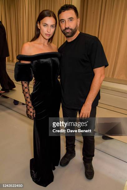 Irina Shayk and CCO of Burberry Riccardo Tisci pose backstage at the Burberry Spring/Summer 2023 runway show in Bermondsey on September 26, 2022 in...