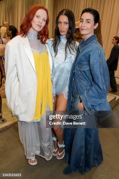 Karen Elson, Bella Hadid and Erin O'Connor pose backstage at the Burberry Spring/Summer 2023 runway show in Bermondsey on September 26, 2022 in...