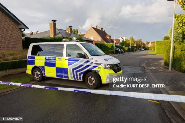 Illustration picture shows a police ribbon and van in the area near the house of Minister Van Quickenborne, in Kortrijk, Monday 26 September 2022. A...