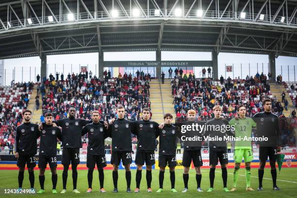 The players of the German team sing the national anthem during the International Friendly match between U20 Romania and U20 Germany at Francisc...