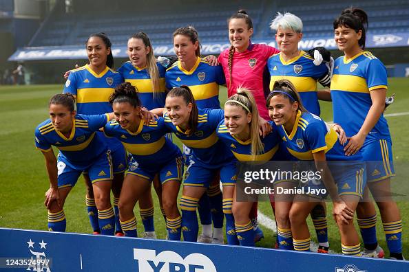 Players of Boca Juniors pose for a team photo before a match between