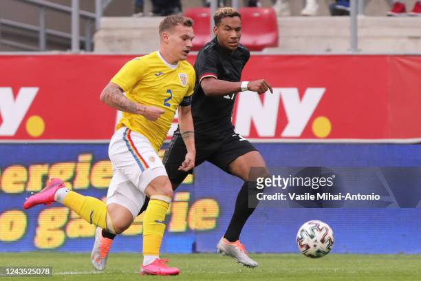 Ben Justus Bobzien of U20 Germany runs to the ball with Alexandru Pantea of U20 Romania during the International Friendly match between U20 Romania...