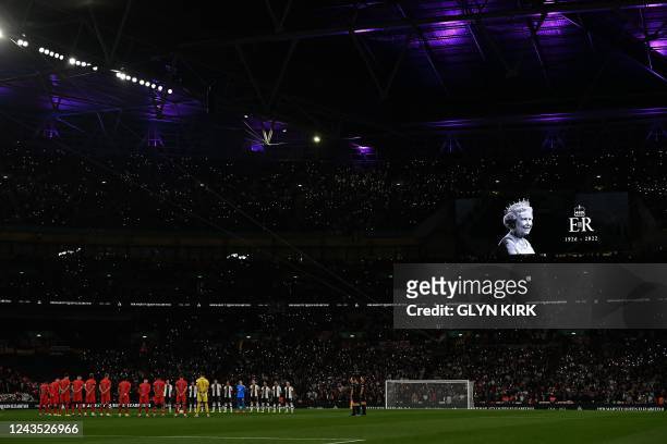 Players and fans observe a minute's silence in tribute to the late Queen Elizabeth II, ahead of the UEFA Nations League group A3 football match...