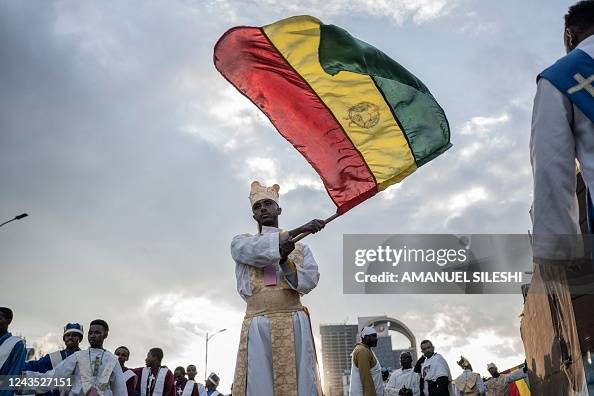 Begashaw TOPSHOT - An Orthodox deacon waves an Ethiopian flag during the... News ...