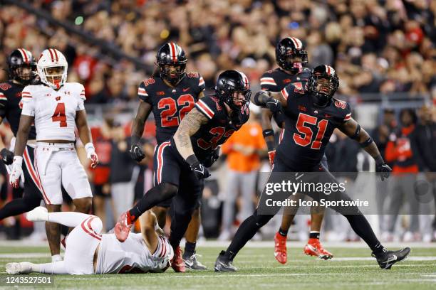 Ohio State Buckeyes defensive end Jack Sawyer and defensive tackle Michael Hall Jr. React after a tackle for loss during a college football game...