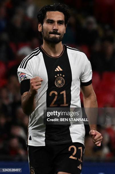 Germany's midfielder Ilkay Gundogan celebrates scoring the opening goal from the penalty spot during the UEFA Nations League group A3 football match...