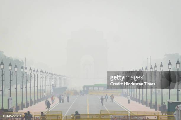 Layer of smog over India Gate during the early hours of the morning on Kartavya Path on September 26, 2022 in New Delhi, India. Delhites woke up to a...