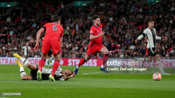 Harry Maguire of England and Jamal Musiala of Germany battle for the ball during the UEFA Nations League League A Group 3 match between England and...