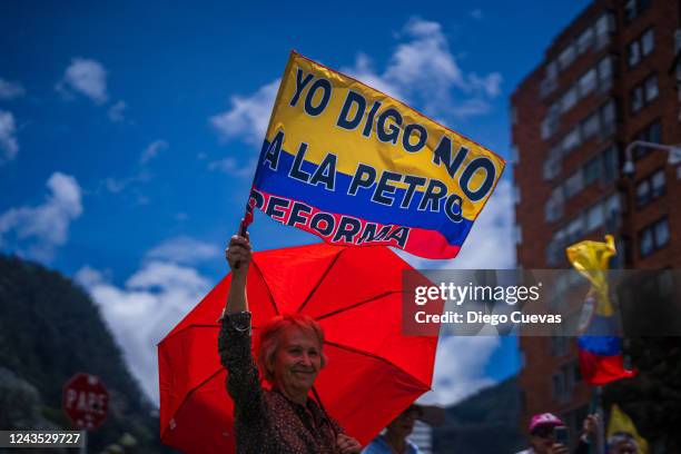 Anti-government demonstrator waves a Colombian flag during a protest against the tax reform proposed by President Gustavo Petro on September 26, 2022...