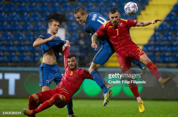 Robert Ivanov of Finland and Marko Vesovic of Montenegro during the UEFA Nations League League B Group 3 match between Montenegro and Finland at...