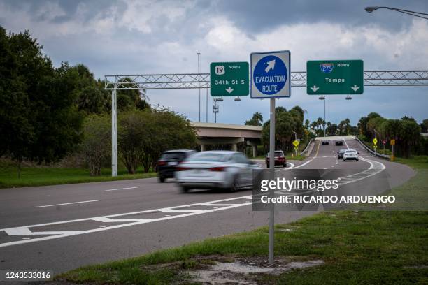 Hurricane evacuation sign is seen as Hurricane Ian approaches in St. Petersburg, Florida on September 26, 2022. - In Florida, the city of Tampa was...