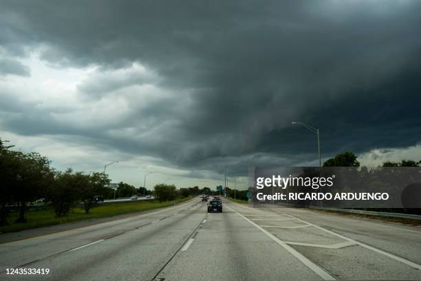 Storm clouds are seen as Hurricane Ian approaches in St. Petersburg, Florida on September 26, 2022. - In Florida, the city of Tampa was under a...