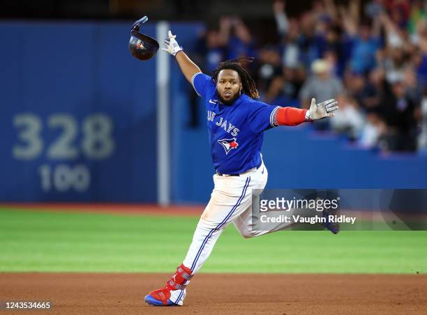 Vladimir Guerrero Jr. #27 of the Toronto Blue Jays celebrates his walk-off RBI single in the 10th inning for a 3-2 win against the New York Yankees...