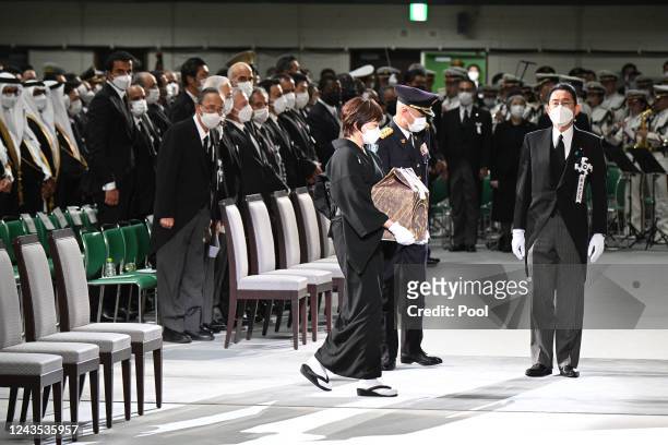 The widow of former Japanese prime minister Shinzo Abe, Akie Abe , carries his ashes as she arrives for the start of his state funeral on September...
