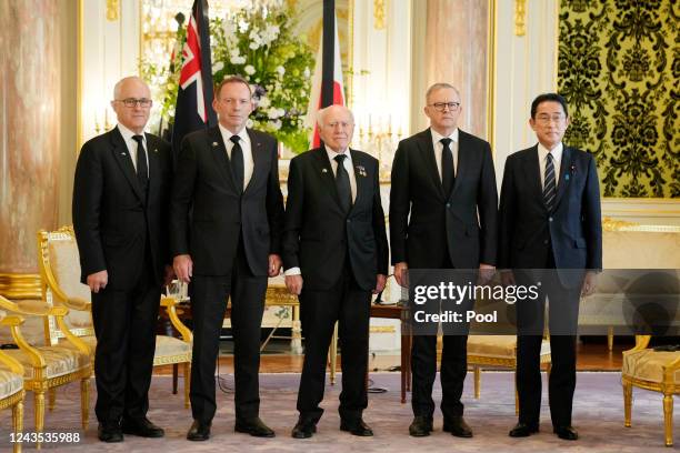 Former Australian Prime Ministers Malcolm Turnbull, from left, Tony Abbott, John Howard and current Prime Minister Anthony Albanese pose for a photo...