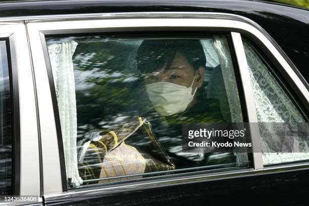Vehicle carrying former Japanese Prime Minister Shinzo Abe's wife Akie and his ashes heads to the Nippon Budokan hall in Tokyo on Sept. 27 for Abe's...