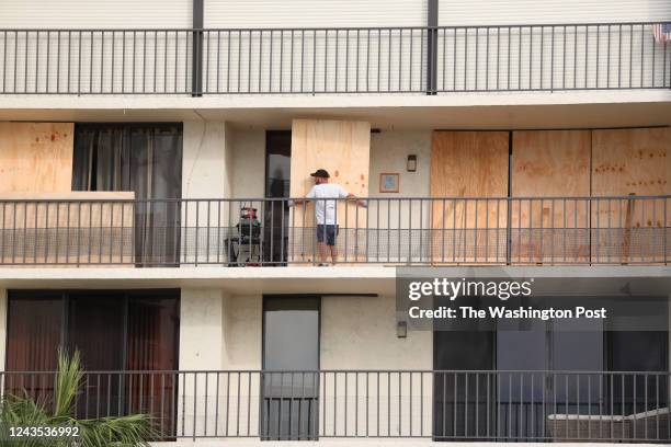 Condominium resident boards up their home located on Indian Rocks Beach in Pinellas County where the government prepares for the potential impact of...