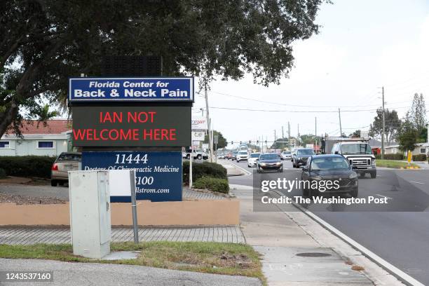 Sign reading Ian Not Welcome Here is seen in Pinellas County where Hurricane Ian is projected to impact the Florida Gulf Coast in Largo, Florida on...