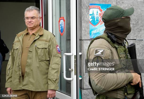 Konstantin Ivashchenko , former CEO of the Azovmash plant and appointed pro-Russian mayor of Mariupol, visits a polling station as people vote in a...