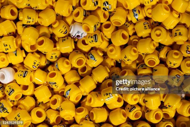 September 2022, Bavaria, Munich: Various heads of Lego figures are seen at a press event in the city center before the opening of the new Lego store....