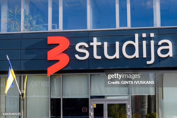 An Ukrainian national flag is seen outside the TV 3 Studio, where Russian Dozhd television channel is currently based, in Riga, Latvia on September...