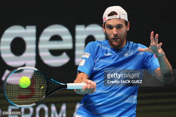 Botic van de Zandschulp of the Netherlands returns the ball to Joao Sousa of Portugal during their men's singles match at the Tel Aviv Watergen Open...