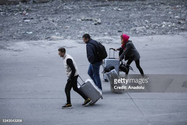 Russians are seen attempting to leave their country to avoid a military call-up for the Russia-Ukraine war as queues have formed at the Kazbegi...