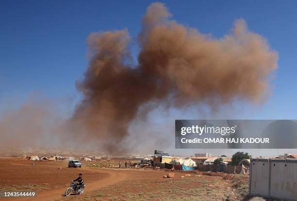 Smoke billows following Russian airstrikes near Syria's Bab al-Hawa border crossing with Turkey on September 27 according to AFP correspondents and...