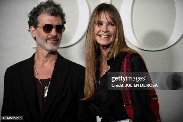 Australian model Elle Macpherson and guest arrive to attend the Dior Spring-Summer 2023 fashion show as part of the Paris Fashion Week, in Paris, on...