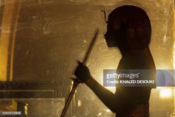 This picture shows a view of the decorated wooden statue of the Royal Ka Guardian spirit of the ancient Egyptian New Kingdom Pharaoh Tutankhamun ,...