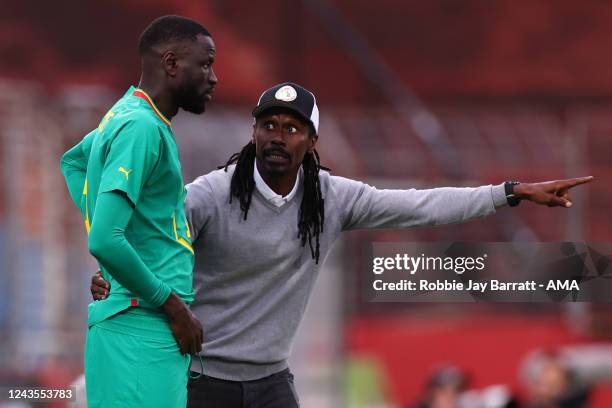 Cheikhou Kouyate of Senegal and Aliou Cisse the head coach / manager of Senegal during the International Friendly between Senegal and Iran at Motion...