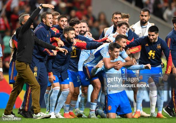 Spain's forward Alvaro Morata celebrates with teammates after his team victory in the UEFA Nations League, league A, group 2 football match between...