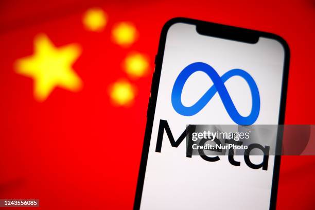 The Meta logo is seen on a mobile phone with the Chinese flag in the background in this photo illustration in Warsaw, Poland on 27 September, 2022.